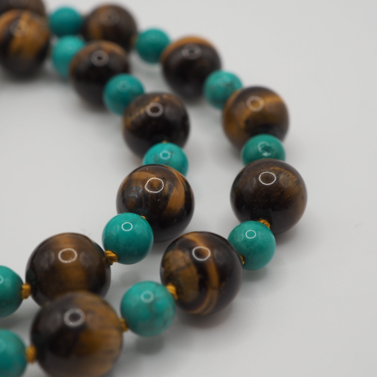 Collana Nodini occhio di tigre turchese